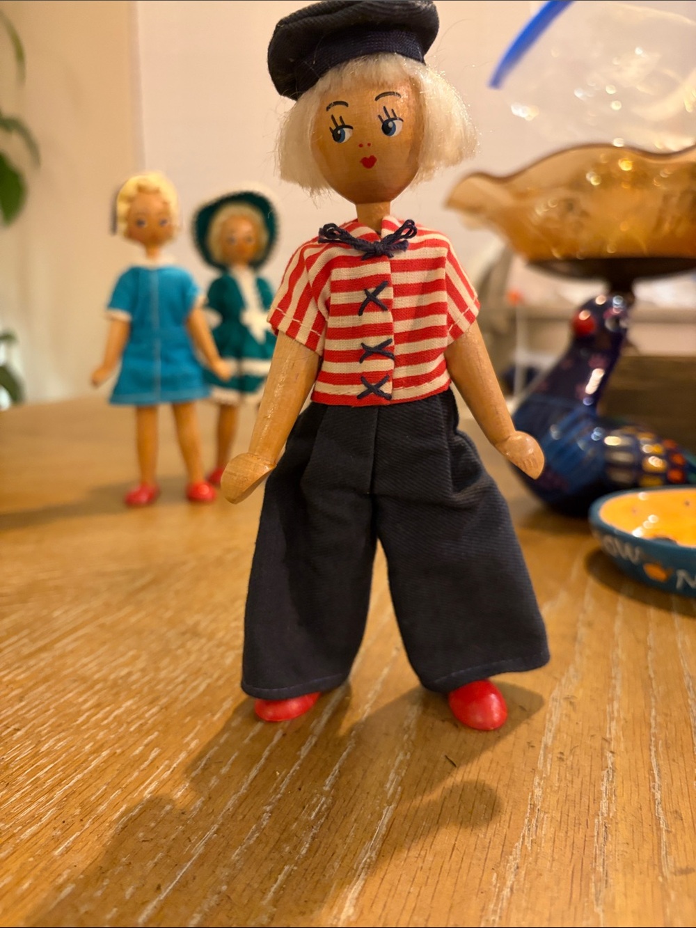 This is a vintage wooden chairClassic Wooden Sailor Doll in Red, Navy & White -